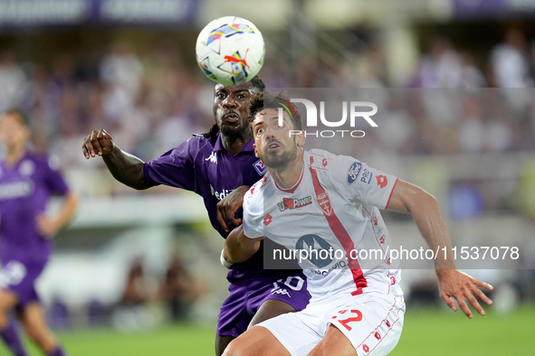 Moise Kean of ACF Fiorentina and Pablo Mari' of AC Monza compete for the ball during the Serie A Enilive match between ACF Fiorentina and AC...