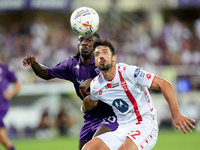 Moise Kean of ACF Fiorentina and Pablo Mari' of AC Monza compete for the ball during the Serie A Enilive match between ACF Fiorentina and AC...