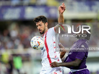 Moise Kean of ACF Fiorentina and Pablo Mari' of AC Monza compete for the ball during the Serie A Enilive match between ACF Fiorentina and AC...