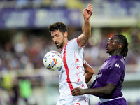 Moise Kean of ACF Fiorentina and Pablo Mari' of AC Monza compete for the ball during the Serie A Enilive match between ACF Fiorentina and AC...