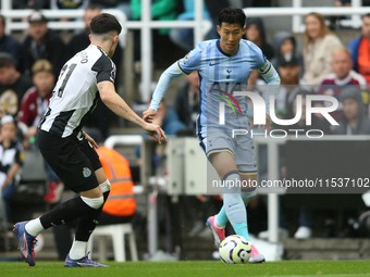 Tottenham Hotspur's Son Heung-Min takes on Newcastle United's Tino Livramento during the Premier League match between Newcastle United and T...