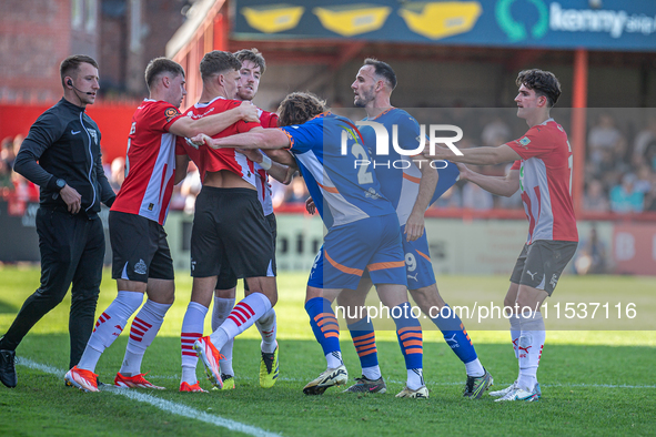 Oldham Athletic's Dan Gardner and Altrincham's Regan Linney battle during the Vanarama National League match between Altrincham and Oldham A...