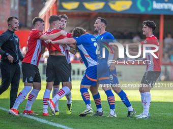 Oldham Athletic's Dan Gardner and Altrincham's Regan Linney battle during the Vanarama National League match between Altrincham and Oldham A...