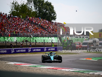 Fernando Alonso of Aston Martin Cognizant F1 Team drives his single-seater during the race of the Italian GP, the 16th round of the Formula...