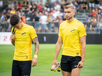 Dawid Kiedrowicz and Michal Feliks stand before the game between Wieczysta Krakow and Pogon Grodzisk Mazowiecki in Krakow, Poland, on Septem...