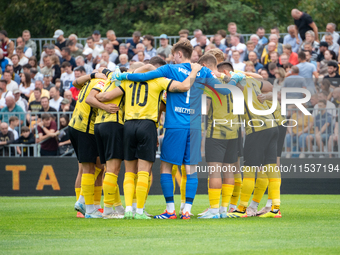 Wieczysta players huddle before the game between Wieczysta Krakow and Pogon Grodzisk Mazowiecki in Krakow, Poland, on September 1, 2024. Pol...