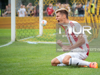 Kamil Odolak celebrates his team scoring a goal in a game between Wieczysta Krakow and Pogon Grodzisk Mazowiecki in Krakow, Poland, on Septe...