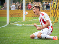 Kamil Odolak celebrates his team scoring a goal in a game between Wieczysta Krakow and Pogon Grodzisk Mazowiecki in Krakow, Poland, on Septe...