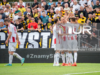 Pogon players celebrate scoring a goal in a game between Wieczysta Krakow and Pogon Grodzisk Mazowiecki in Krakow, Poland, on September 1, 2...