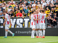 Pogon players celebrate scoring a goal in a game between Wieczysta Krakow and Pogon Grodzisk Mazowiecki in Krakow, Poland, on September 1, 2...