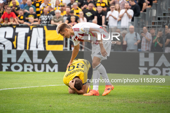 Daniel Mikolajewski and Kamil Odolak play in a game between Wieczysta Krakow and Pogon Grodzisk Mazowiecki in Krakow, Poland, on September 1...