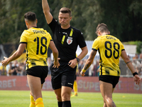 Referee Tomasz Wajda shows a yellow card to Manuel Torres during a game between Wieczysta Krakow and Pogon Grodzisk Mazowiecki in Krakow, Po...