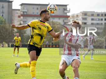 Manuel Torres and Grzegorz Skowronski play in a game between Wieczysta Krakow and Pogon Grodzisk Mazowiecki in Krakow, Poland, on September...