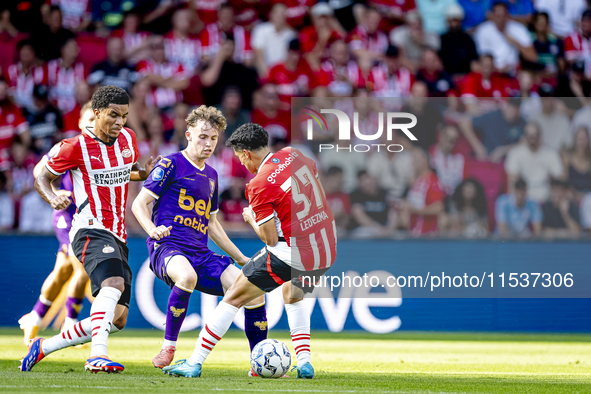 Go Ahead Eagles player Jakob Breum, PSV player Malik Tillman, and PSV player Richard Ledezma during the match PSV vs. Go Ahead Eagles at the...