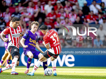 Go Ahead Eagles player Jakob Breum, PSV player Malik Tillman, and PSV player Richard Ledezma during the match PSV vs. Go Ahead Eagles at the...