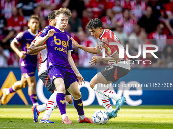 Go Ahead Eagles player Jakob Breum and PSV player Richard Ledezma during the match PSV vs. Go Ahead Eagles at the Philips Stadium for the Du...