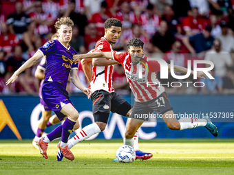 Go Ahead Eagles player Jakob Breum and PSV player Richard Ledezma during the match PSV vs. Go Ahead Eagles at the Philips Stadium for the Du...