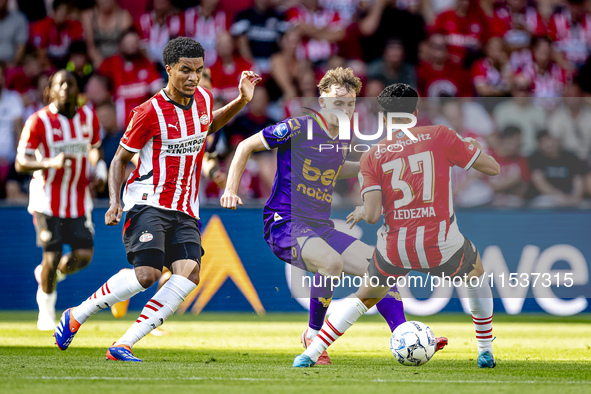 Go Ahead Eagles player Jakob Breum, PSV player Malik Tillman, and PSV player Richard Ledezma during the match PSV vs. Go Ahead Eagles at the...