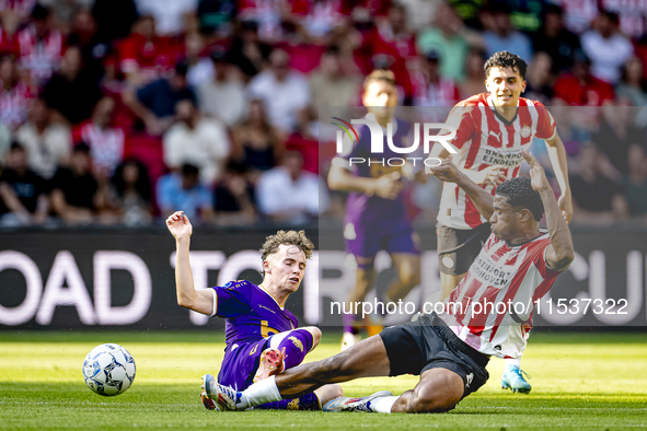 Go Ahead Eagles player Jakob Breum and PSV player Ryan Flamingo during the match PSV vs. Go Ahead Eagles at the Philips Stadium for the Dutc...