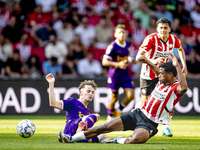 Go Ahead Eagles player Jakob Breum and PSV player Ryan Flamingo during the match PSV vs. Go Ahead Eagles at the Philips Stadium for the Dutc...