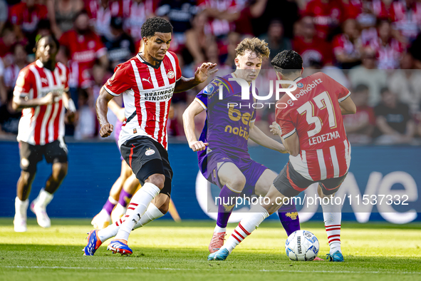 Go Ahead Eagles player Jakob Breum, PSV player Malik Tillman, and PSV player Richard Ledezma during the match PSV vs. Go Ahead Eagles at the...