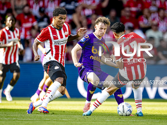 Go Ahead Eagles player Jakob Breum, PSV player Malik Tillman, and PSV player Richard Ledezma during the match PSV vs. Go Ahead Eagles at the...