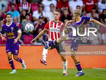 PSV player Joey Veerman and Go Ahead Eagles player Finn Stokkers during the match PSV vs. Go Ahead Eagles at the Philips Stadium for the Dut...