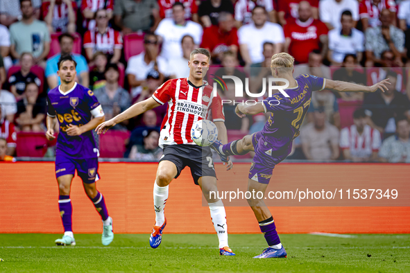 PSV player Joey Veerman and Go Ahead Eagles player Finn Stokkers during the match PSV vs. Go Ahead Eagles at the Philips Stadium for the Dut...