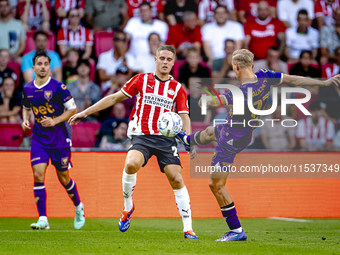 PSV player Joey Veerman and Go Ahead Eagles player Finn Stokkers during the match PSV vs. Go Ahead Eagles at the Philips Stadium for the Dut...