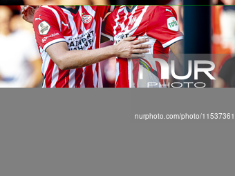 PSV player Joey Veerman and PSV player Malik Tillman celebrate a goal during the match between PSV and Go Ahead Eagles at the Philips Stadiu...