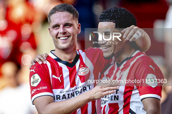 PSV player Joey Veerman and PSV player Malik Tillman celebrate a goal during the match between PSV and Go Ahead Eagles at the Philips Stadiu...