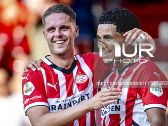 PSV player Joey Veerman and PSV player Malik Tillman celebrate a goal during the match between PSV and Go Ahead Eagles at the Philips Stadiu...