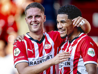 PSV player Joey Veerman and PSV player Malik Tillman celebrate a goal during the match between PSV and Go Ahead Eagles at the Philips Stadiu...