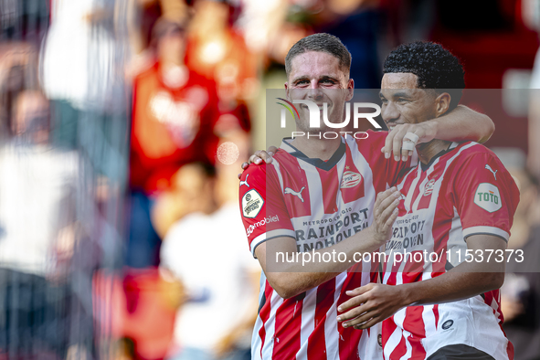 PSV player Joey Veerman and PSV player Malik Tillman celebrate a goal during the match between PSV and Go Ahead Eagles at the Philips Stadiu...