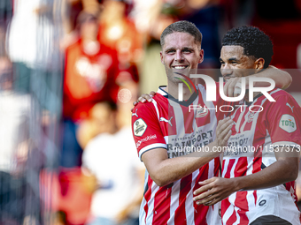 PSV player Joey Veerman and PSV player Malik Tillman celebrate a goal during the match between PSV and Go Ahead Eagles at the Philips Stadiu...