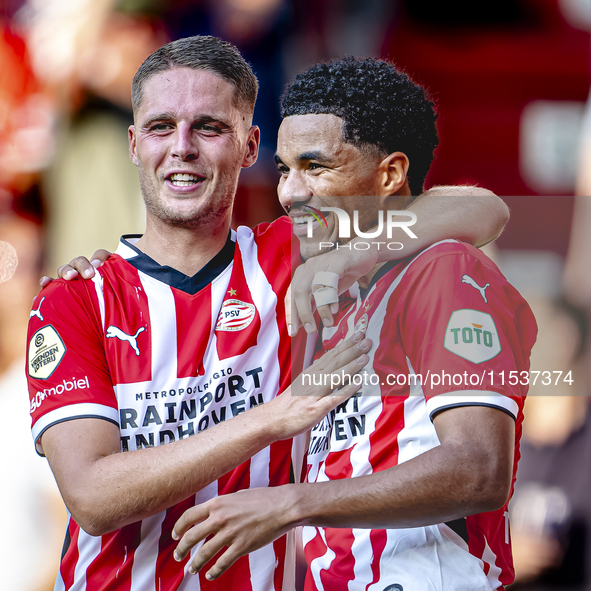 PSV player Joey Veerman and PSV player Malik Tillman celebrate a goal during the match between PSV and Go Ahead Eagles at the Philips Stadiu...