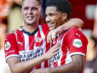 PSV player Joey Veerman and PSV player Malik Tillman celebrate a goal during the match between PSV and Go Ahead Eagles at the Philips Stadiu...