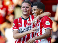 PSV player Joey Veerman and PSV player Malik Tillman celebrate a goal during the match between PSV and Go Ahead Eagles at the Philips Stadiu...