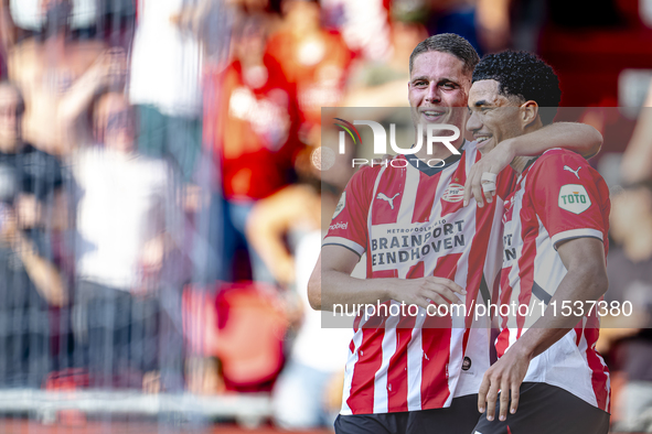 PSV player Joey Veerman and PSV player Malik Tillman celebrate a goal during the match between PSV and Go Ahead Eagles at the Philips Stadiu...