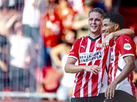 PSV player Joey Veerman and PSV player Malik Tillman celebrate a goal during the match between PSV and Go Ahead Eagles at the Philips Stadiu...