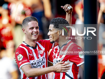 PSV player Joey Veerman and PSV player Malik Tillman celebrate a goal during the match between PSV and Go Ahead Eagles at the Philips Stadiu...