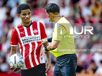 PSV player Malik Tillman and referee Bas Nijhuis during the match between PSV and Go Ahead Eagles at the Philips Stadium for the Dutch Eredi...