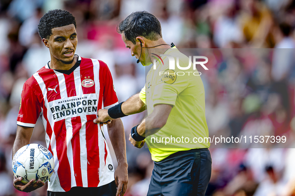 PSV player Malik Tillman and referee Bas Nijhuis during the match between PSV and Go Ahead Eagles at the Philips Stadium for the Dutch Eredi...