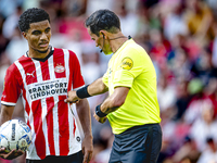 PSV player Malik Tillman and referee Bas Nijhuis during the match between PSV and Go Ahead Eagles at the Philips Stadium for the Dutch Eredi...