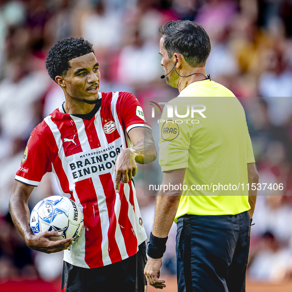 PSV player Malik Tillman and referee Bas Nijhuis during the match between PSV and Go Ahead Eagles at the Philips Stadium for the Dutch Eredi...