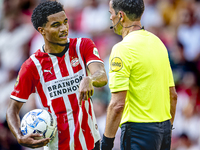 PSV player Malik Tillman and referee Bas Nijhuis during the match between PSV and Go Ahead Eagles at the Philips Stadium for the Dutch Eredi...