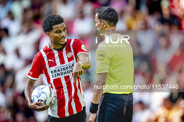 PSV player Malik Tillman and referee Bas Nijhuis during the match between PSV and Go Ahead Eagles at the Philips Stadium for the Dutch Eredi...