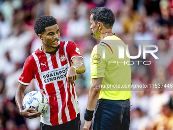 PSV player Malik Tillman and referee Bas Nijhuis during the match between PSV and Go Ahead Eagles at the Philips Stadium for the Dutch Eredi...