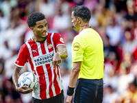 PSV player Malik Tillman and referee Bas Nijhuis during the match between PSV and Go Ahead Eagles at the Philips Stadium for the Dutch Eredi...