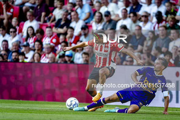 PSV player Couhaib Driouech and Go Ahead Eagles player Mats Deijl during the match PSV vs. Go Ahead Eagles at the Philips Stadium for the Du...